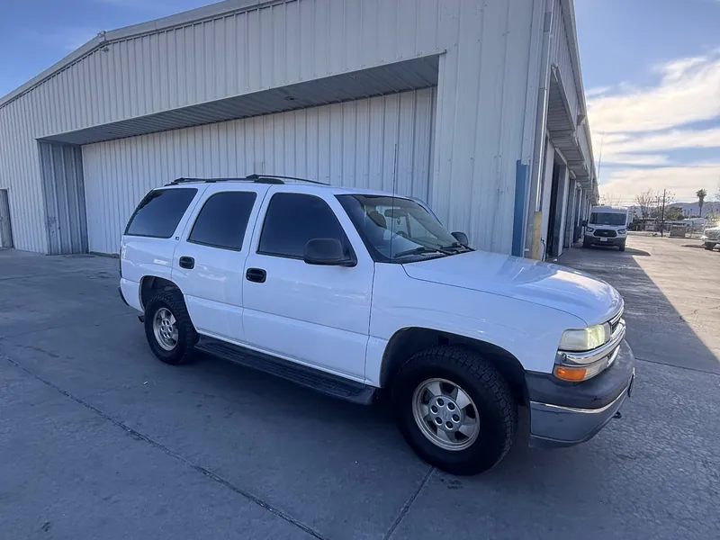 White Chevy Tahoe back on the road after an alternator repair