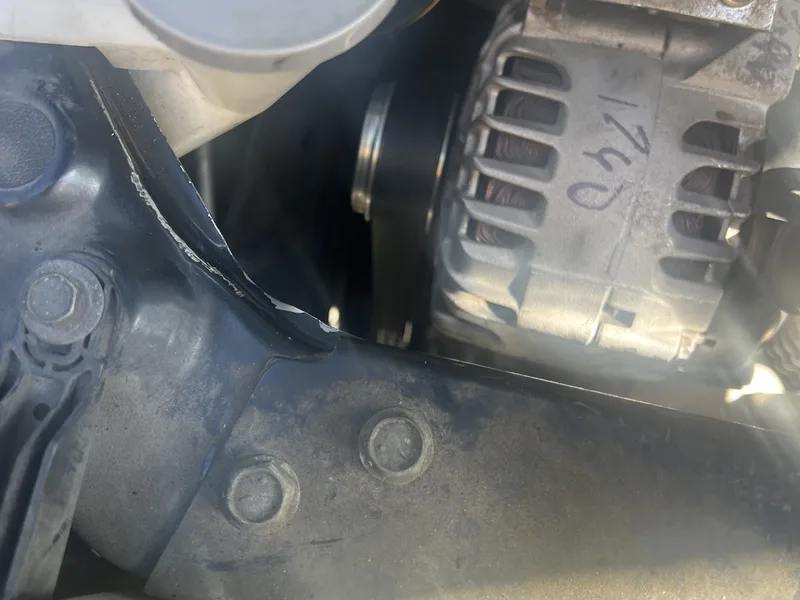 New alternator and serpentine belt installed in the engine bay