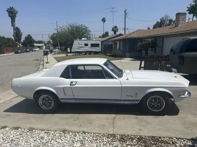 Mustang side profile on the street, June 2025