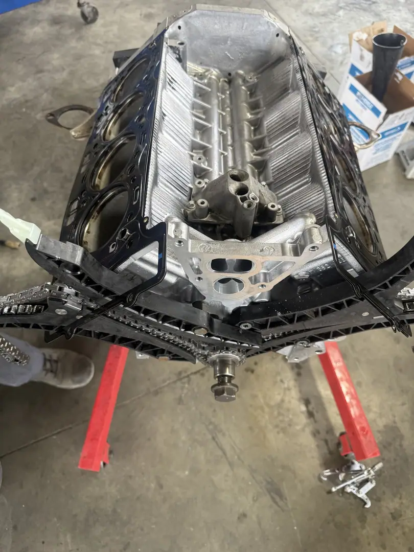 A bare V8 block on an engine stand with the cylinders exposed