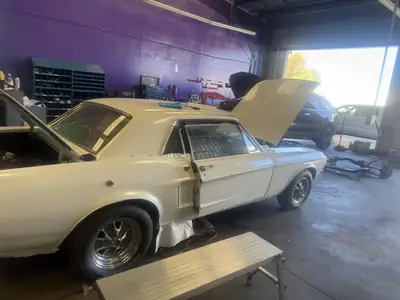 Mustang parked in the shop bay, December 2025