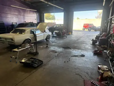 Mustang in the bays with the doors open behind it