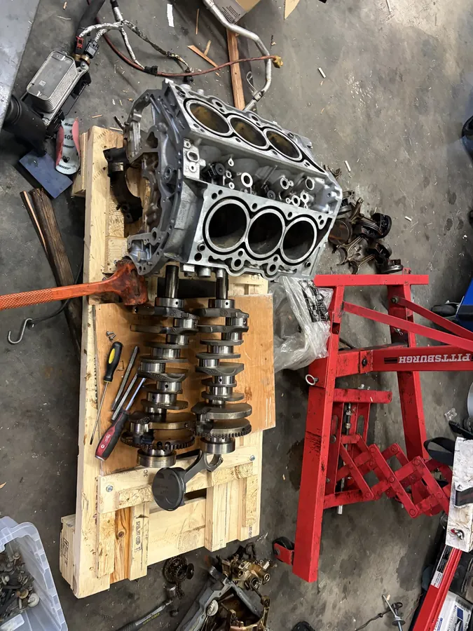 Engine block and crankshaft on engine stand