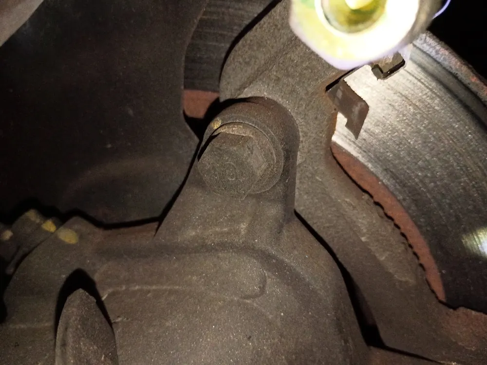 Brake caliper detail during a mobile brake job