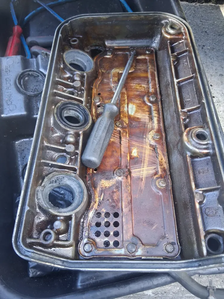 Valve cover interior coated in sludge from skipped oil changes