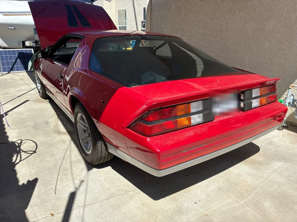 Red Camaro in a customer driveway for a mobile repair