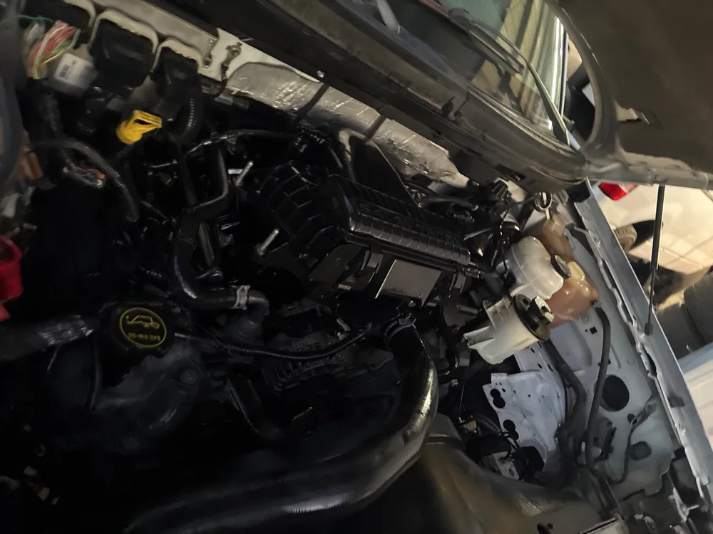 The engine bay of a 2006 Ford F-150 seen from the passenger side with the hood up