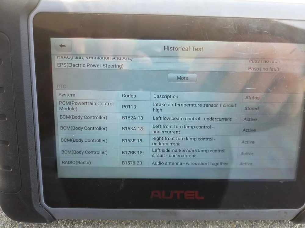Autel scan tool screen listing code P0113 intake air temperature sensor 1 circuit high, plus body controller lamp codes