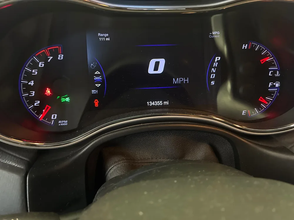 Instrument cluster of a 2015 Jeep Grand Cherokee SRT showing 134,355 miles