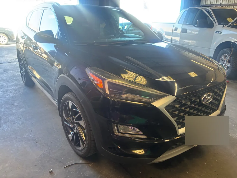A black 2020 Hyundai Tucson parked inside the Supercanic shop before its brake job