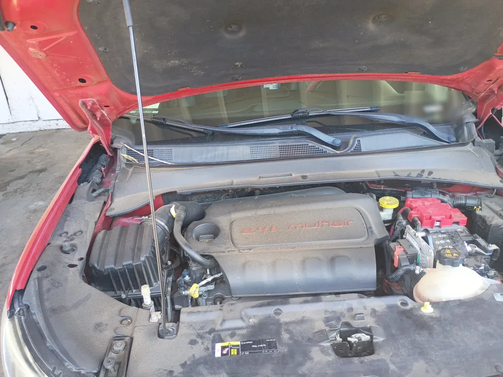 The engine bay of a 2020 Jeep Compass with the 2.4 liter engine, hood open