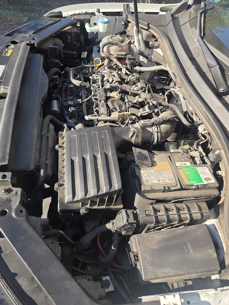 The engine bay of a 2020 Volkswagen Tiguan with the hood open