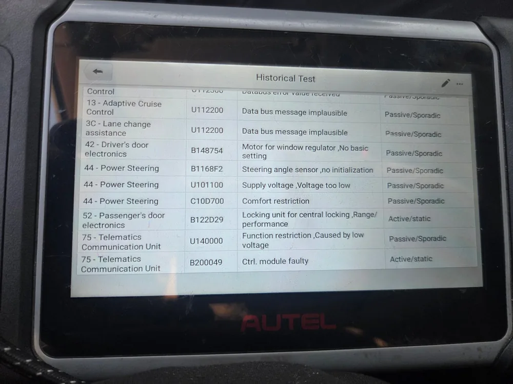 A scan tool screen listing stored trouble codes in several modules of a Volkswagen