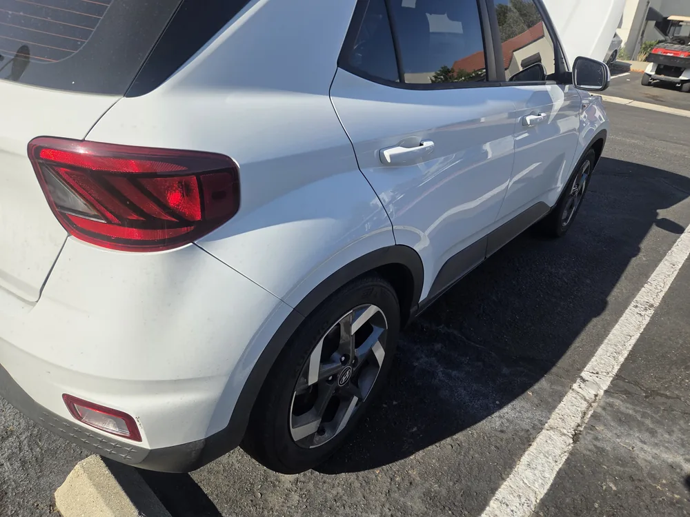 A white 2022 Hyundai Venue parked in a lot in Grand Terrace