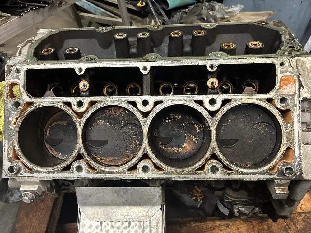 A V8 engine block with the heads off, showing four cylinders and the lifter valley