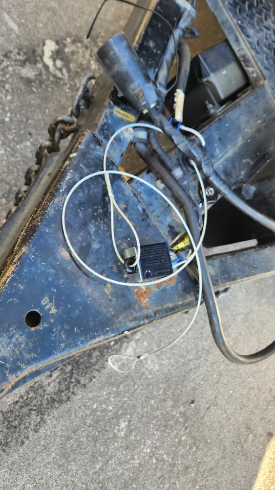 The breakaway switch and its pull cable on the tongue of a cargo trailer
