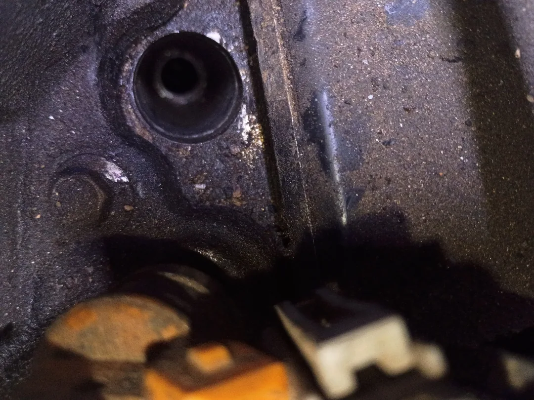 Spark plug hole in a Ford Triton cylinder head with the aluminum threads damaged