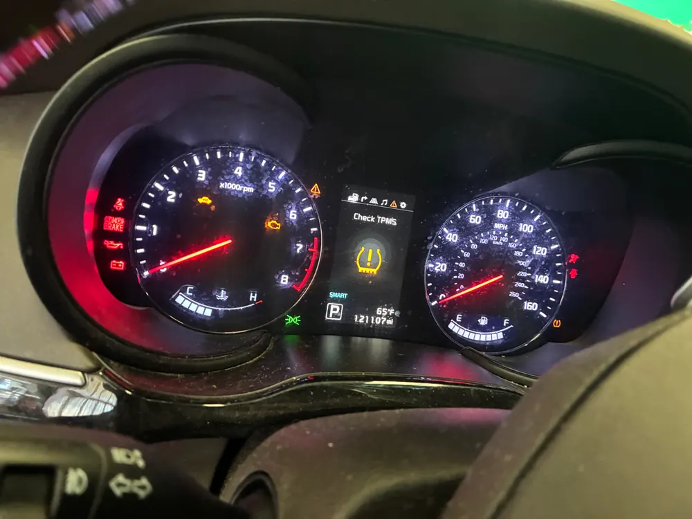 Kia K900 instrument cluster with a check engine light during diagnosis