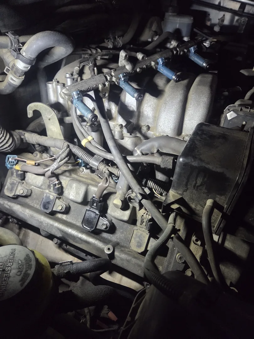 Engine bay opened up for injector work on a Hemet CA vehicle