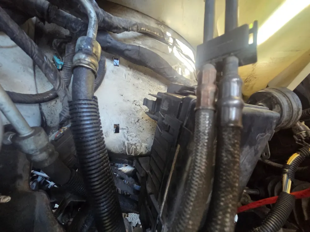 Underhood fuse box checked during a Chevy Express no-start diagnosis