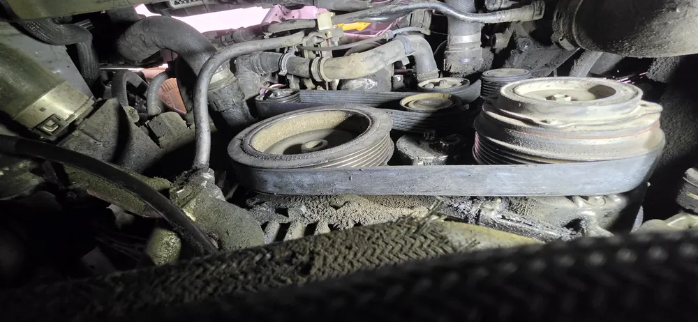 Serpentine belt and pulleys inspected during a breakdown diagnosis in Menifee CA