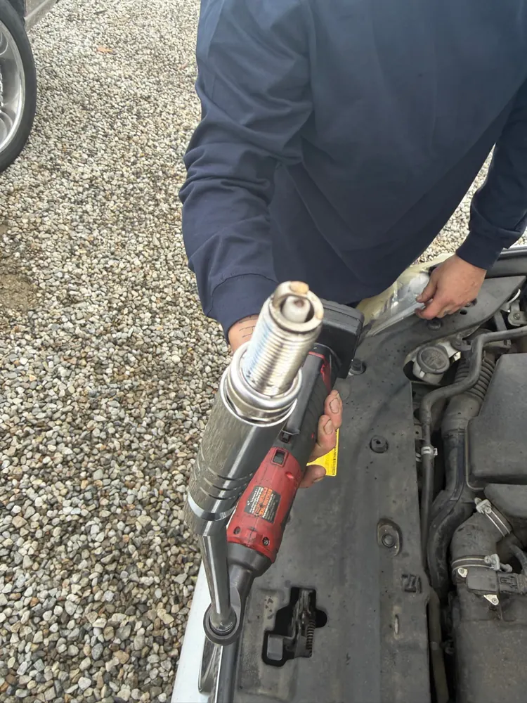 Removing spark plugs on a Lexus CT200h during a misfire diagnostic in Moreno Valley CA