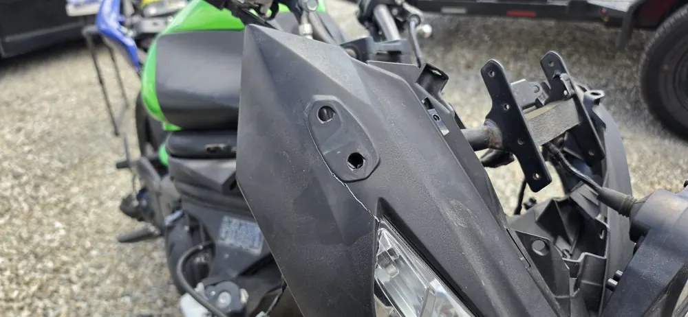 Frame and mounting detail during motorcycle fairing installation