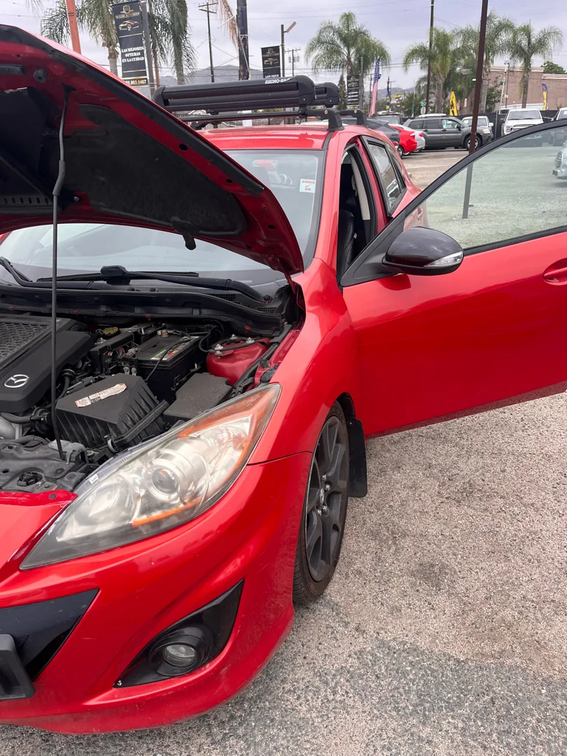 Mazdaspeed 3 with the hood up for inspection in Riverside CA