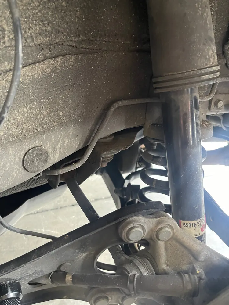 Rear shock and control arms during a suspension diagnostic in San Jacinto CA