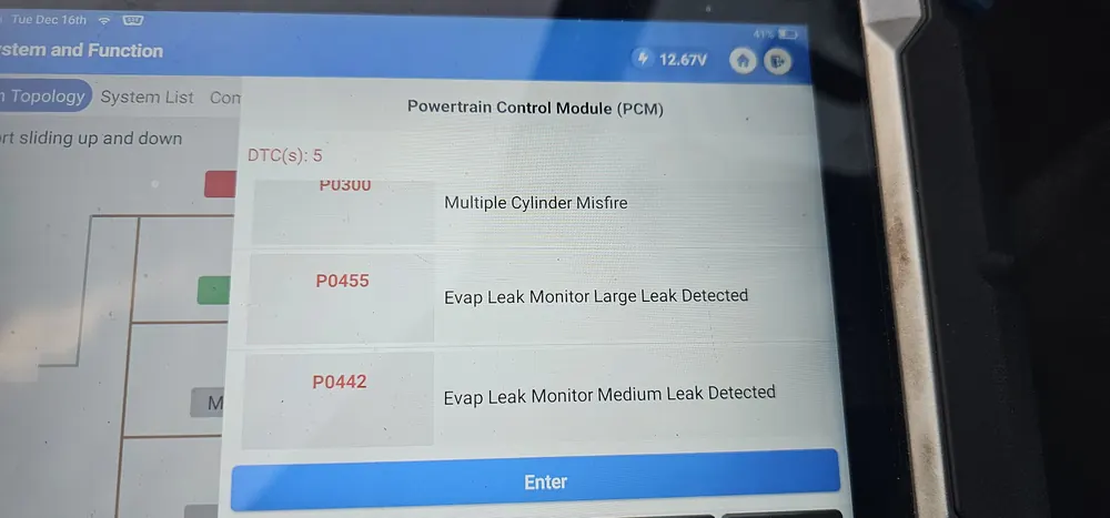 Diagnostic tablet showing P0300 misfire with P0455 and P0442 evap leak codes