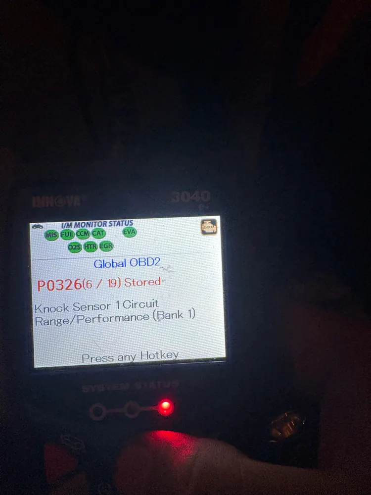 Scan tool showing code P0326 knock sensor circuit range and performance