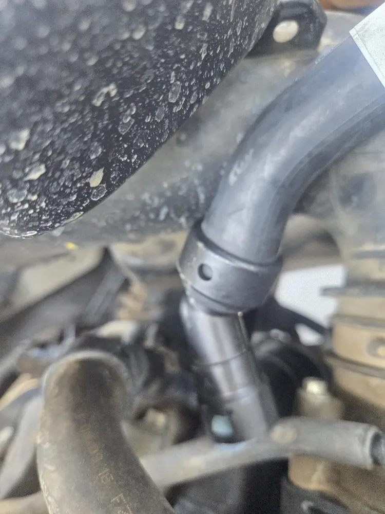 New heater hose fittings during a cooling system repair in Riverside CA