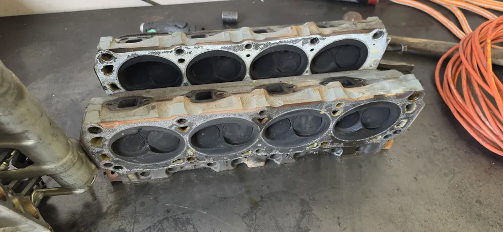 Pair of cylinder heads on the bench during an engine overhaul
