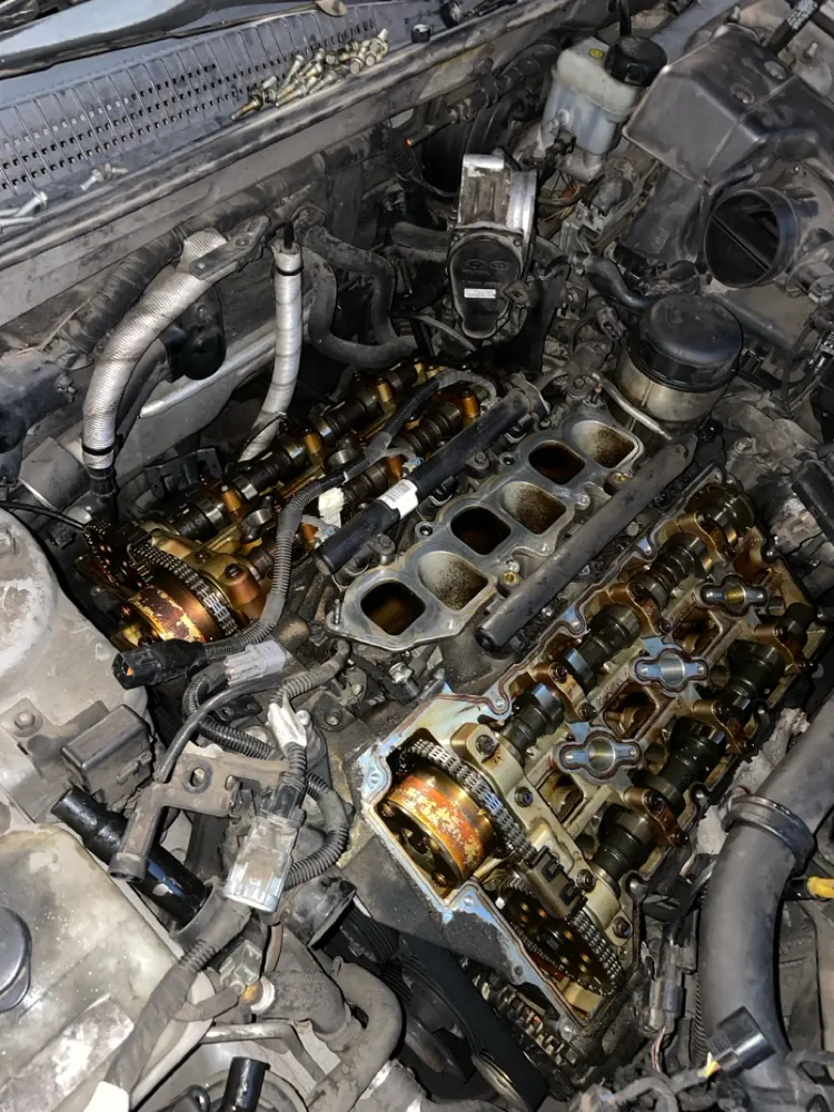 Timing chains and camshafts exposed during an engine teardown