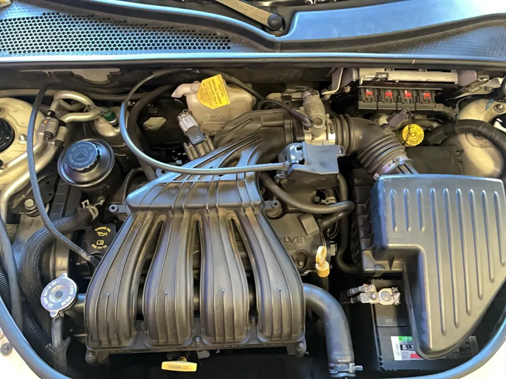 PT Cruiser engine bay during timing and motor mount service