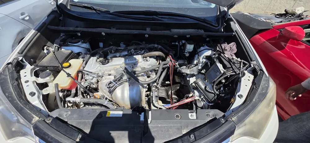 Toyota RAV4 engine bay during transmission replacement at the Supercanic shop