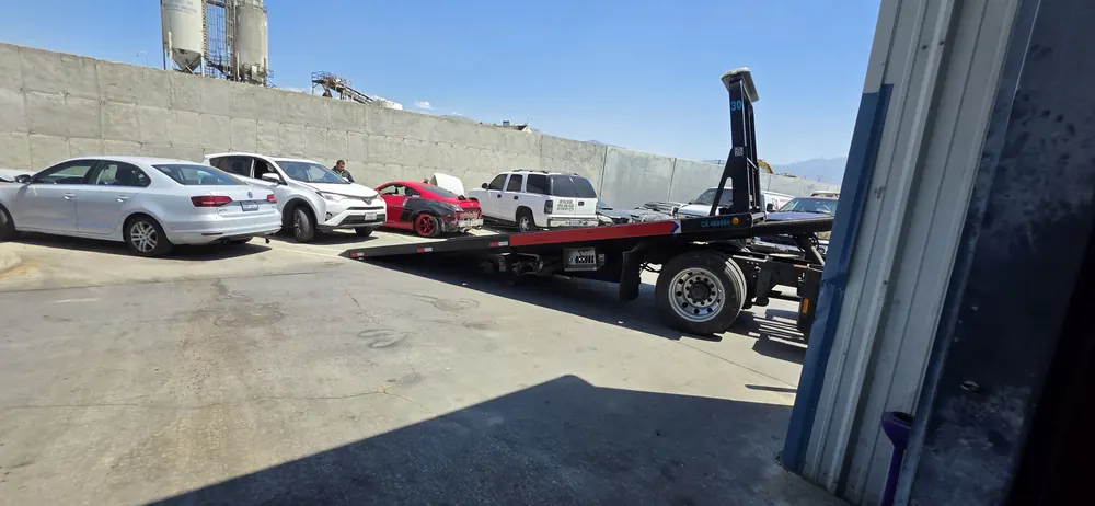 Toyota RAV4 arriving by flatbed for a transmission swap